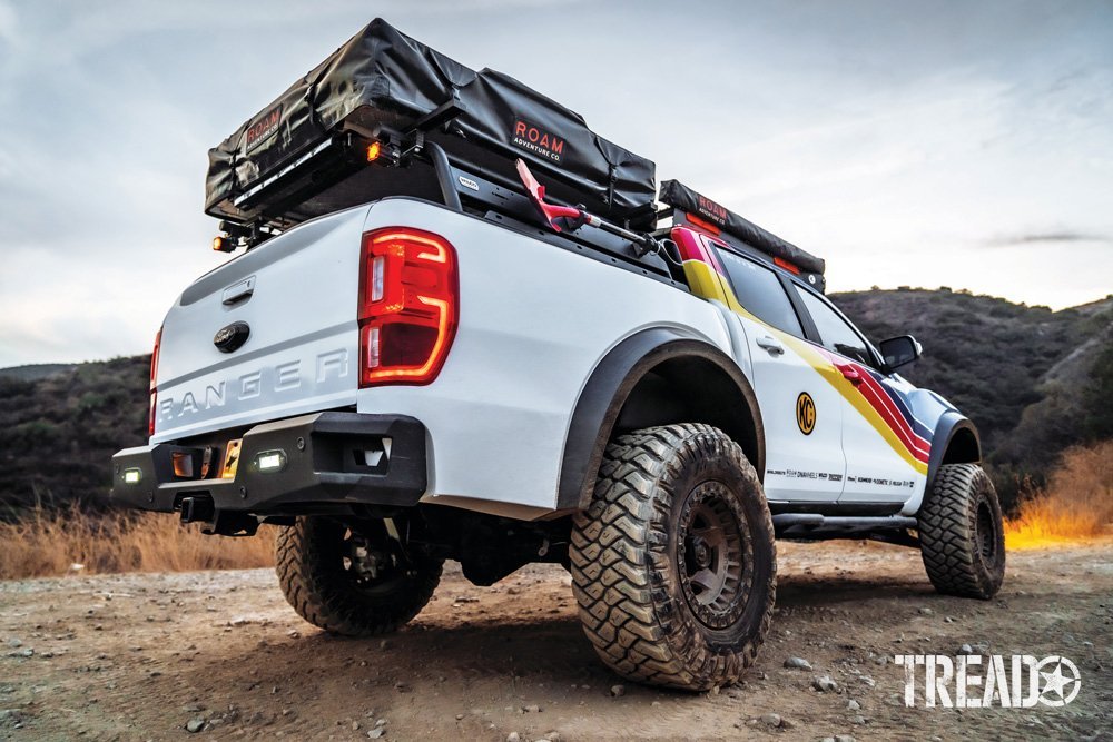 2019 Ford Ranger beauty pose details the bed rack with red shovel and rooftop tent.