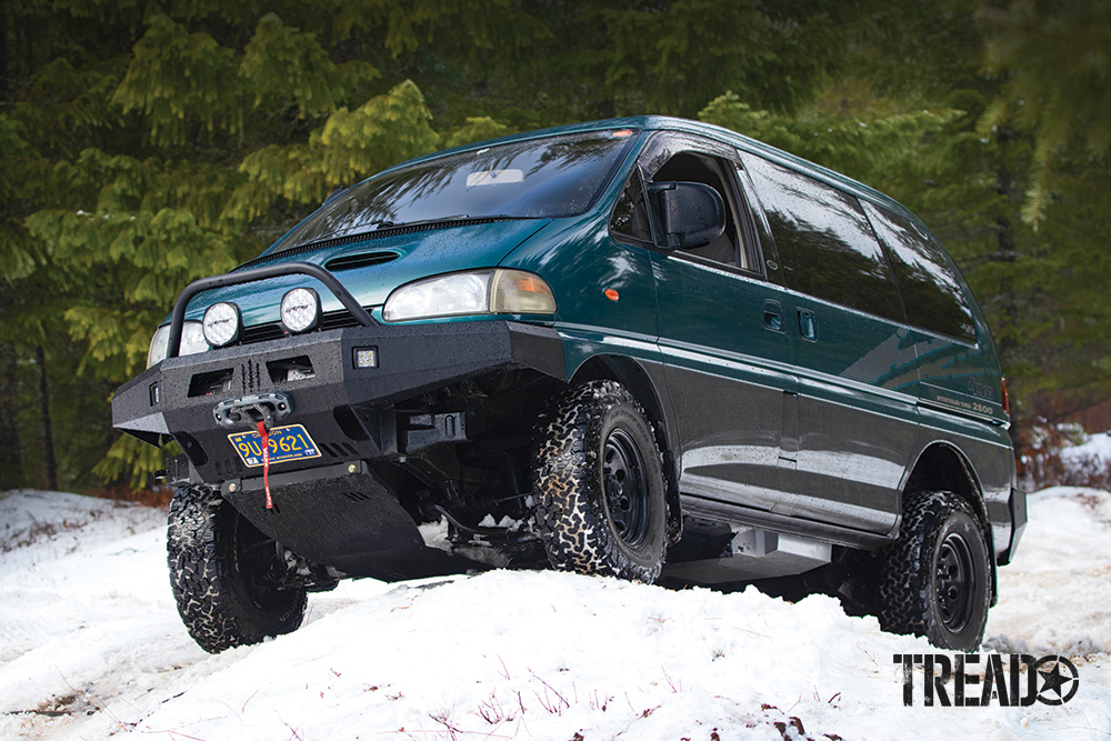 The author's teal and gray Mitsubishi Delica Space Gear traverses snowy trails after the tank was installed. 