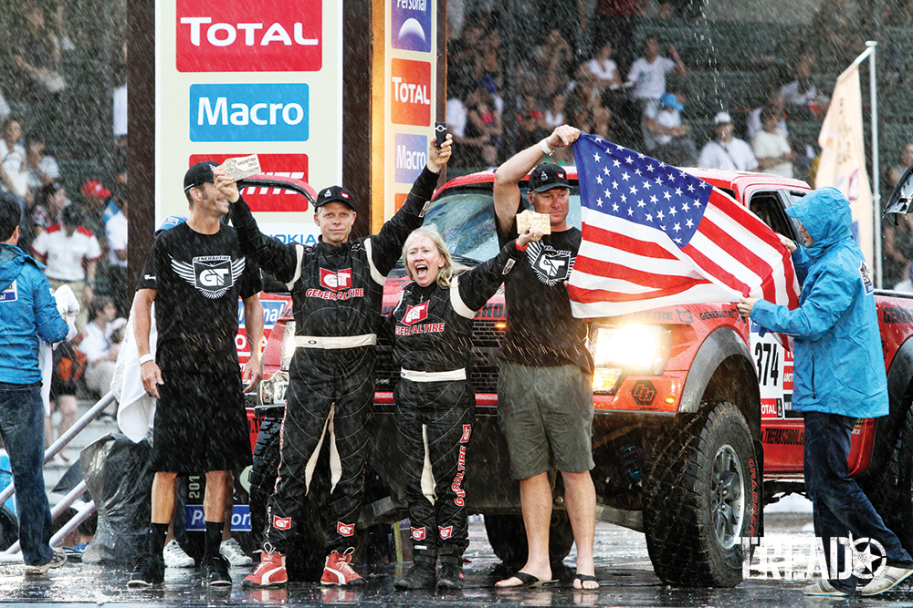 Celebrating on the podium in Buenos Aires, Argentina, was Sue Mead. She was the driver of record with the Ford Raptor USA team (one women, three men) winners of the Open Production Class in the 2011 Dakar Rally as it poured). 