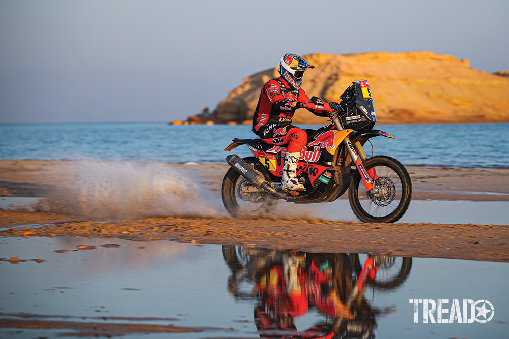 2021 Dakar #05 Sunderland Sam (gbr), KTM, Red Bull KTM Factory Team races through water on a dirt trail. 