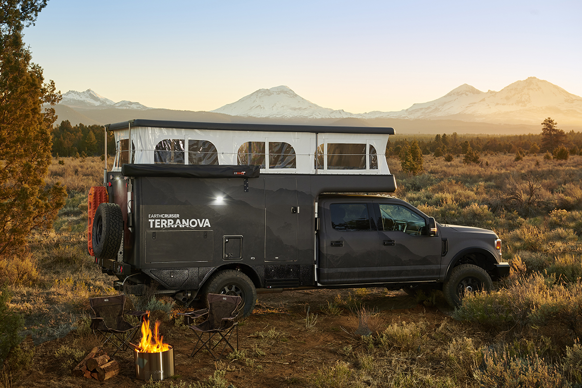 Black truck and Terranova camper with pop top open