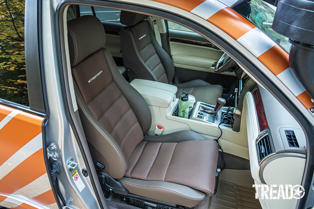 Brown Scheelman seats are shown for driver and front passenger, which replaced factory seats.