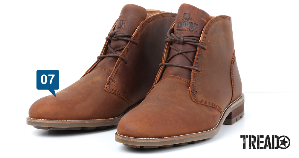 The brown Kodiak/McKernan Chukka Bootmen's hiking boot offers thin laces and soles, with a chunky heel.