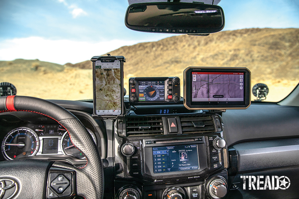 Customized 2017 Toyota 4Runner's dash houses an ICS Fab dash mount with dual charger connects the Garmin Overlander and iPhone, held with a Ram Mounts Quick-Grip waterproof, wireless charging holder.