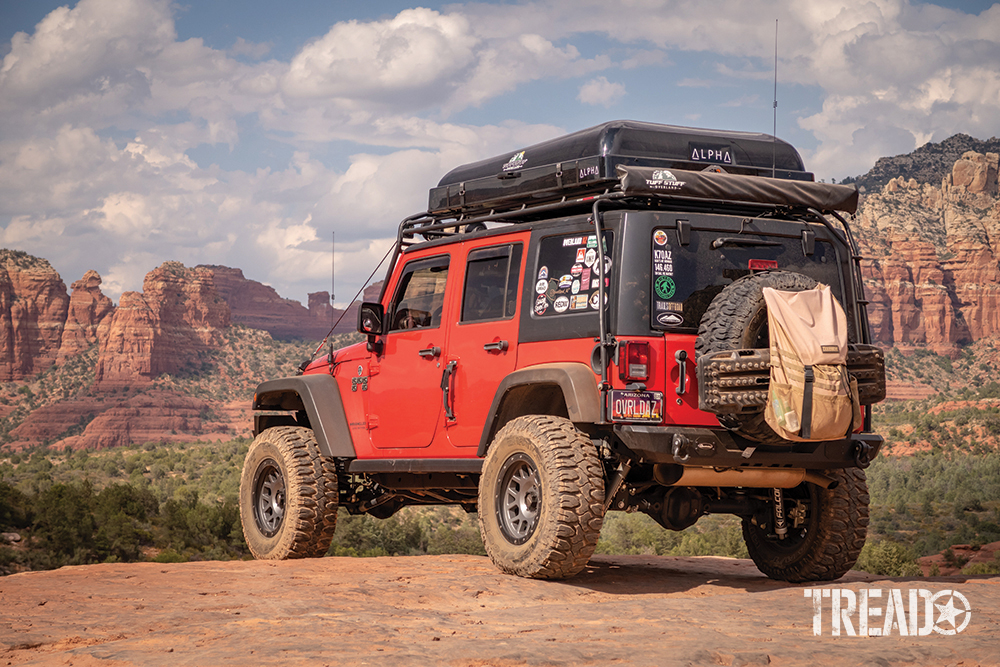 This Jeep peers out over the red rocks of Sedona Arizona along the Broken Arrow trail. It is a popular destination for off-roaders, hikers and sight seekers. 