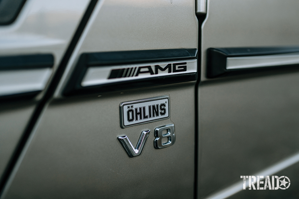 Black and white decals on the silver Mercedes G-Wagen.