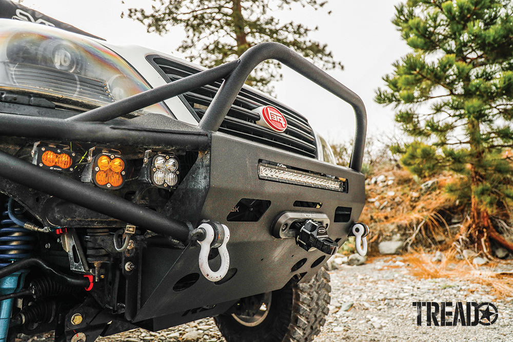 A black Pelfrey front winch bumper houses a Smittybilt winch and Baja Designs Squadron white and amber lights on the Lexus GX470.