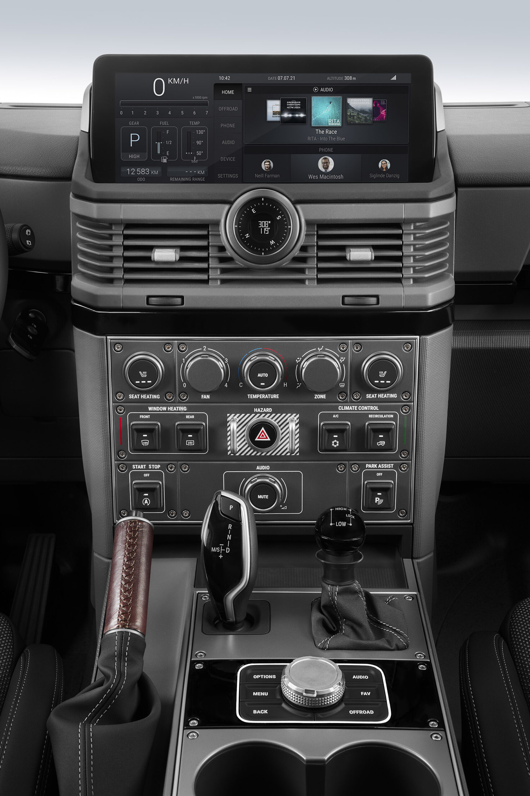 The center stack includes oversized toggle switches, rotary dials, and evenly spaced controls. 