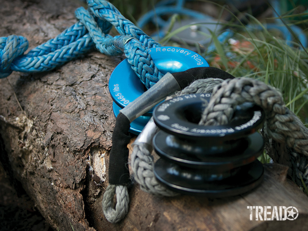 There are various-sized recovery rings on the market to help during the vehicle recovery process. From a blue single and double black rings lay on a log during a demonstration.