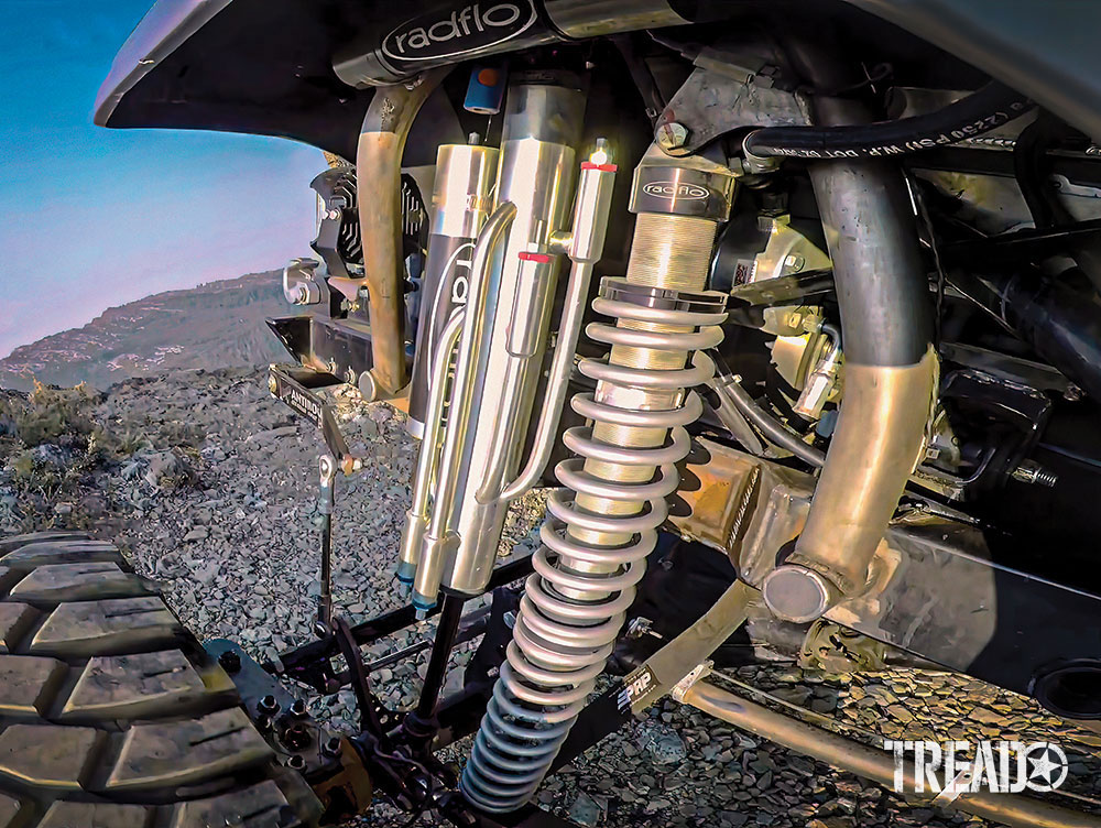 A custom suspension and shocks of front wheel well on Jeep.