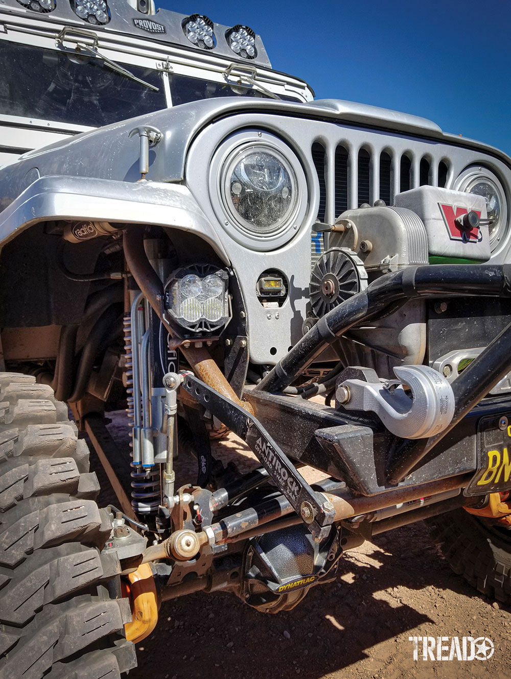 The silver Jeep called Bandoola has a custom front end with winch and tube bumper.