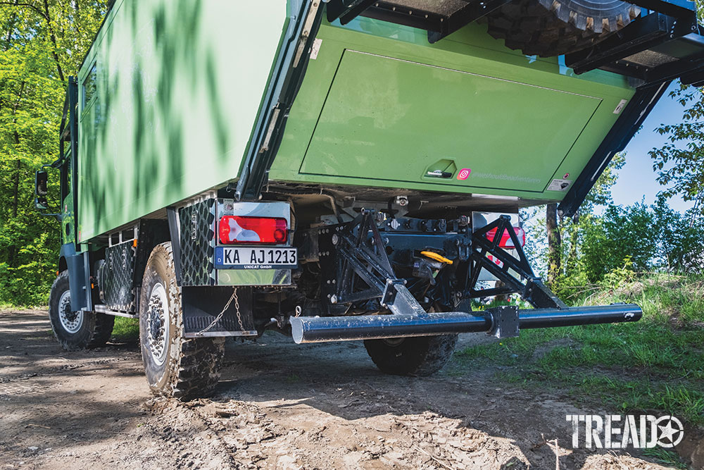 The MAN truck showcases an integrated rear winch and retractable rear under-ride crash guard.