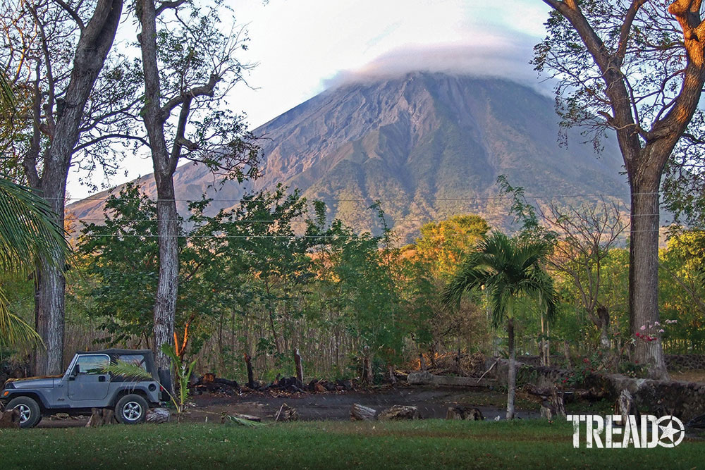 The enormous and active volcano Concepción dominates the skyline.