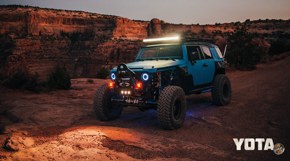 At dusk, the blue FJ Cruiser still stands out. A lightbar up top help light its way.