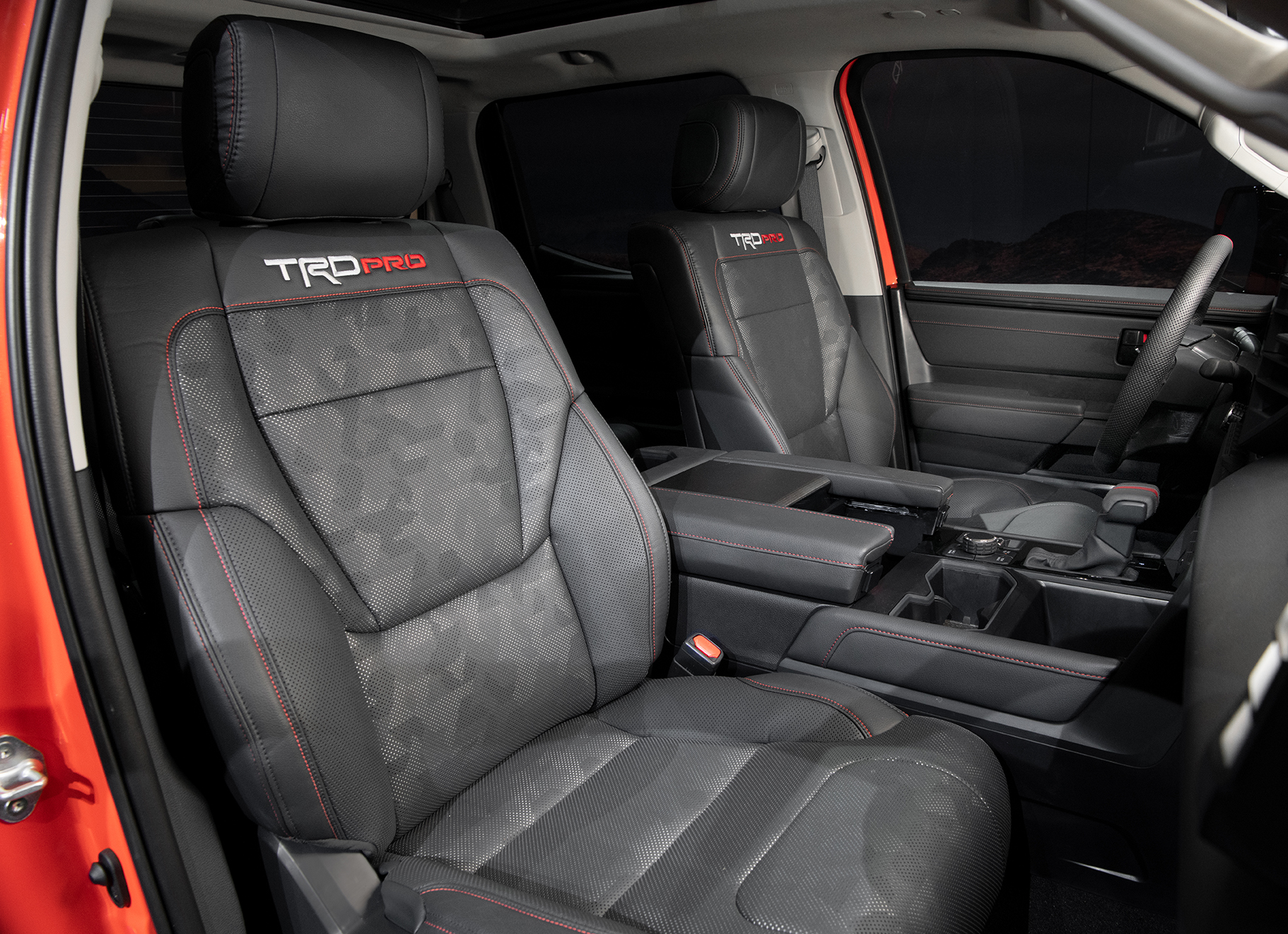 black interior seats of 2022 Toyota Tundra TRD Pro in Solar Octane orange