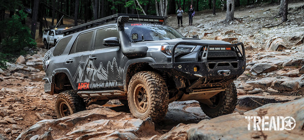 4Runner drives up rocky terrain.