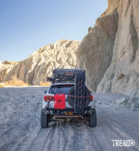 A Stellar Built custom rear swingout bumper holds Rotopax