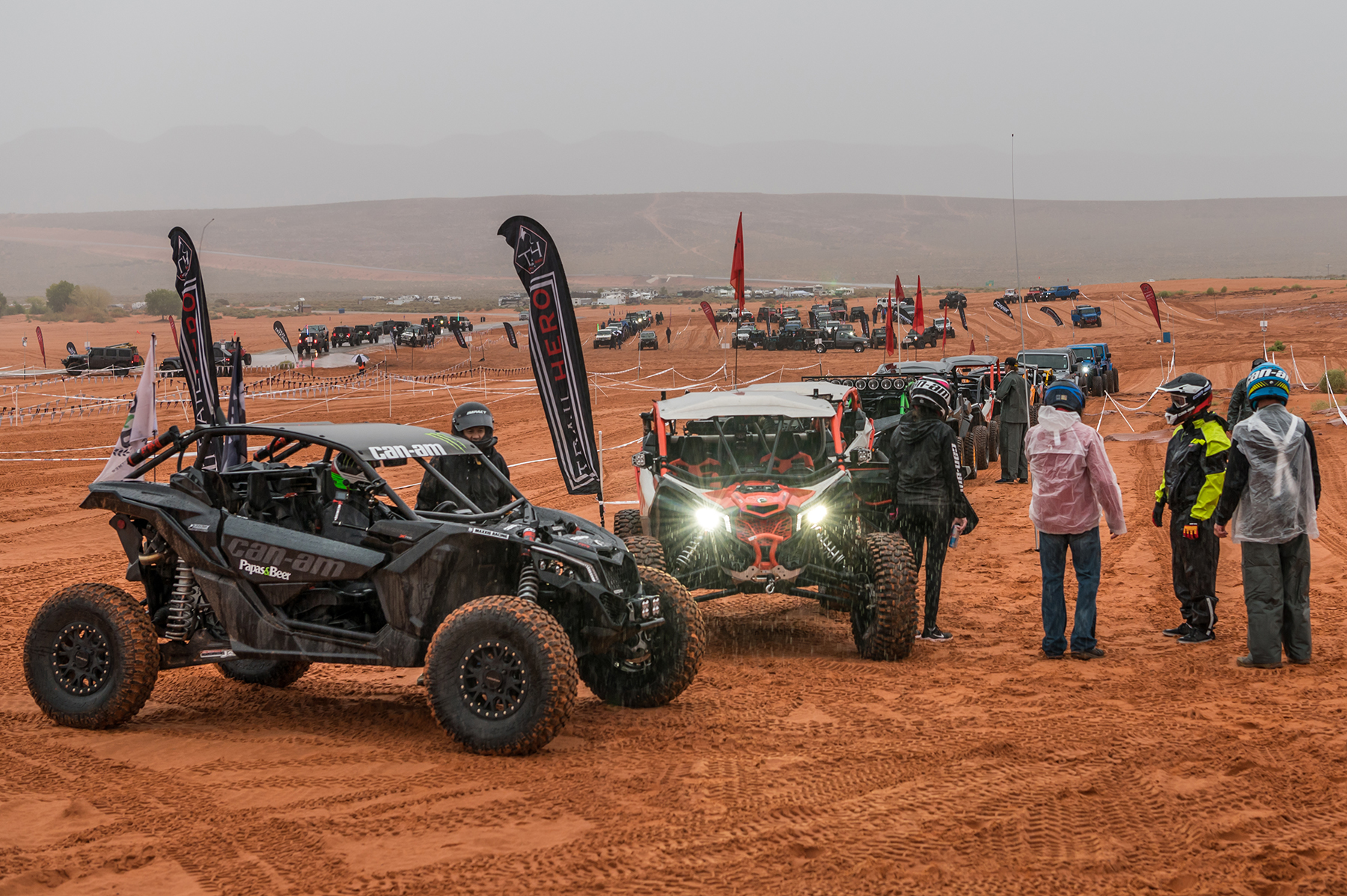 Can-Ams are parked in staging area at International Off Road Day in Sand Hollow State Park at Trail Hero.