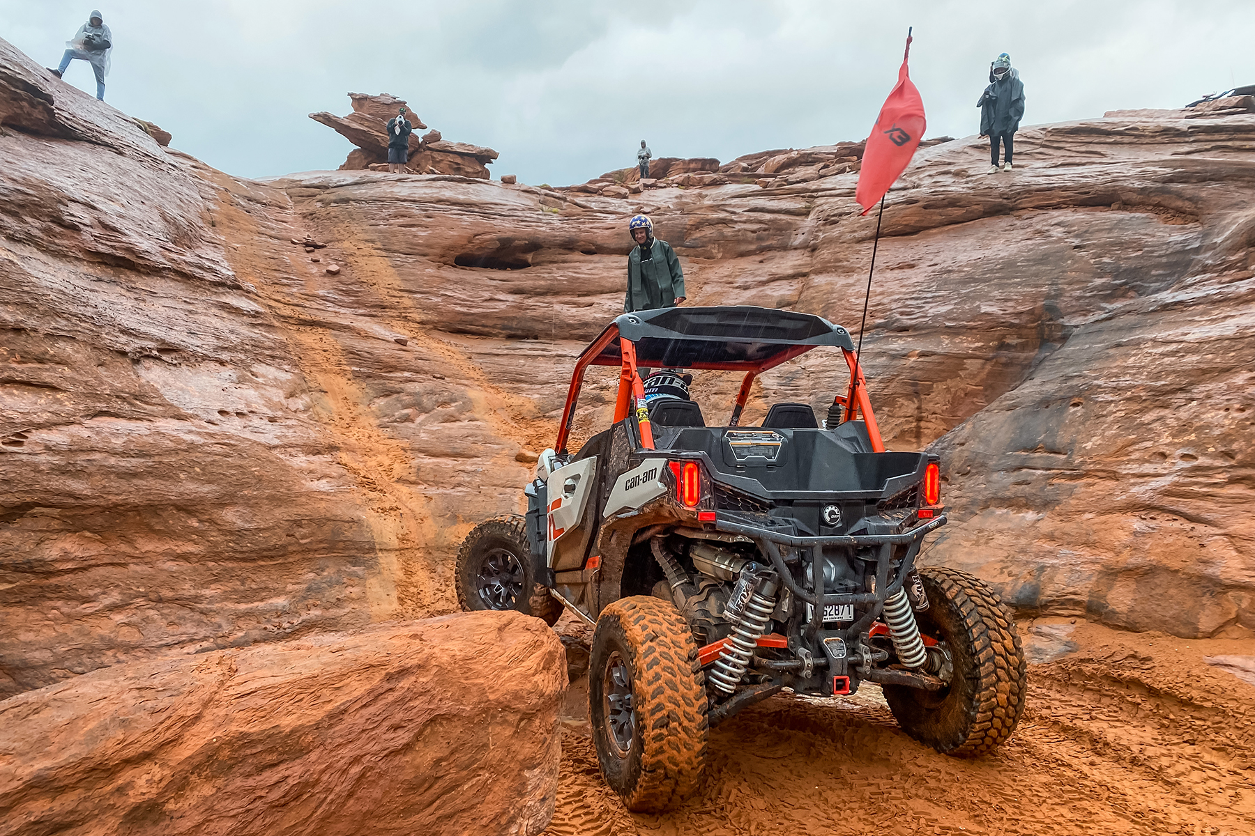 Can-Am drives up steep slippery rocks at International Off Road Day in Sand Hollow State Park at Trail Hero.