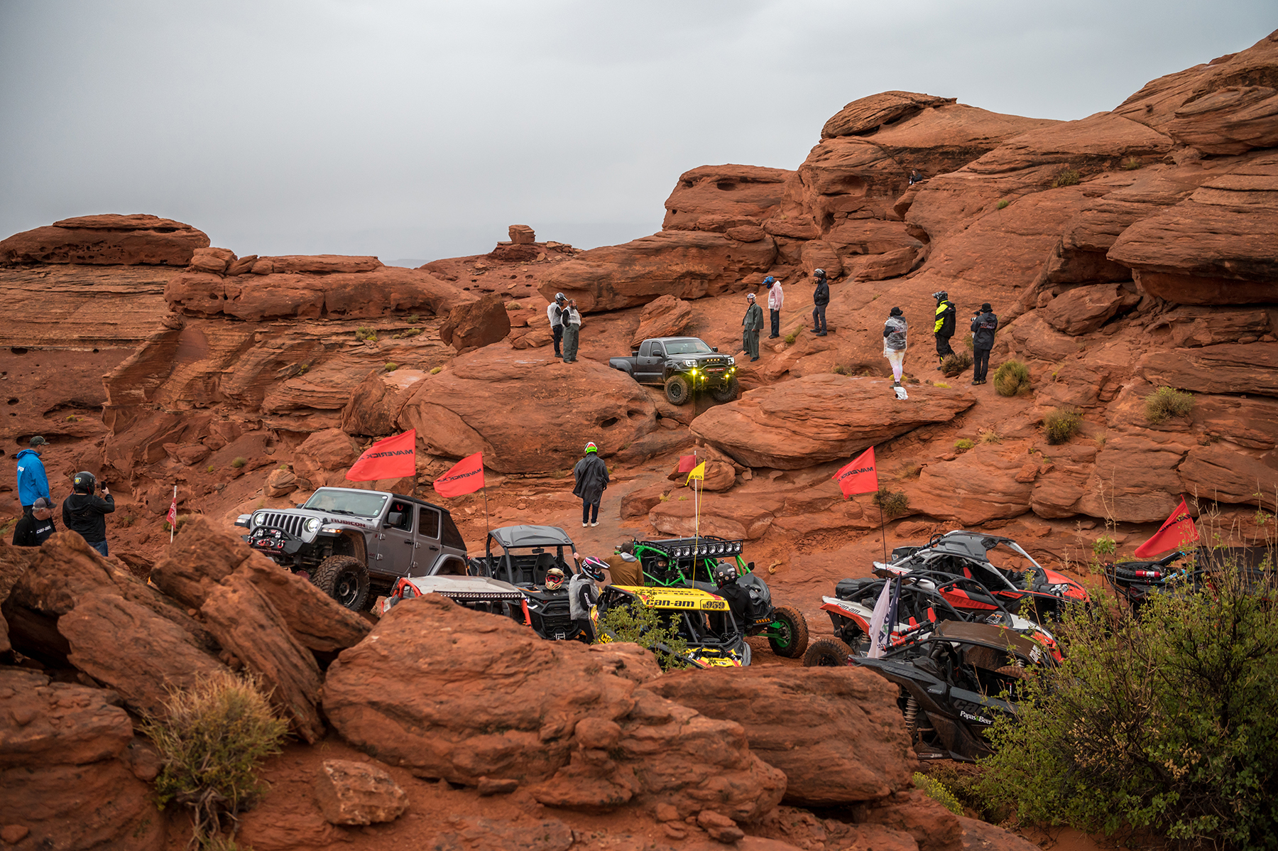 Can-Ams drives up steep slippery rocks at International Off Road Day in Sand Hollow State Park at Trail Hero.