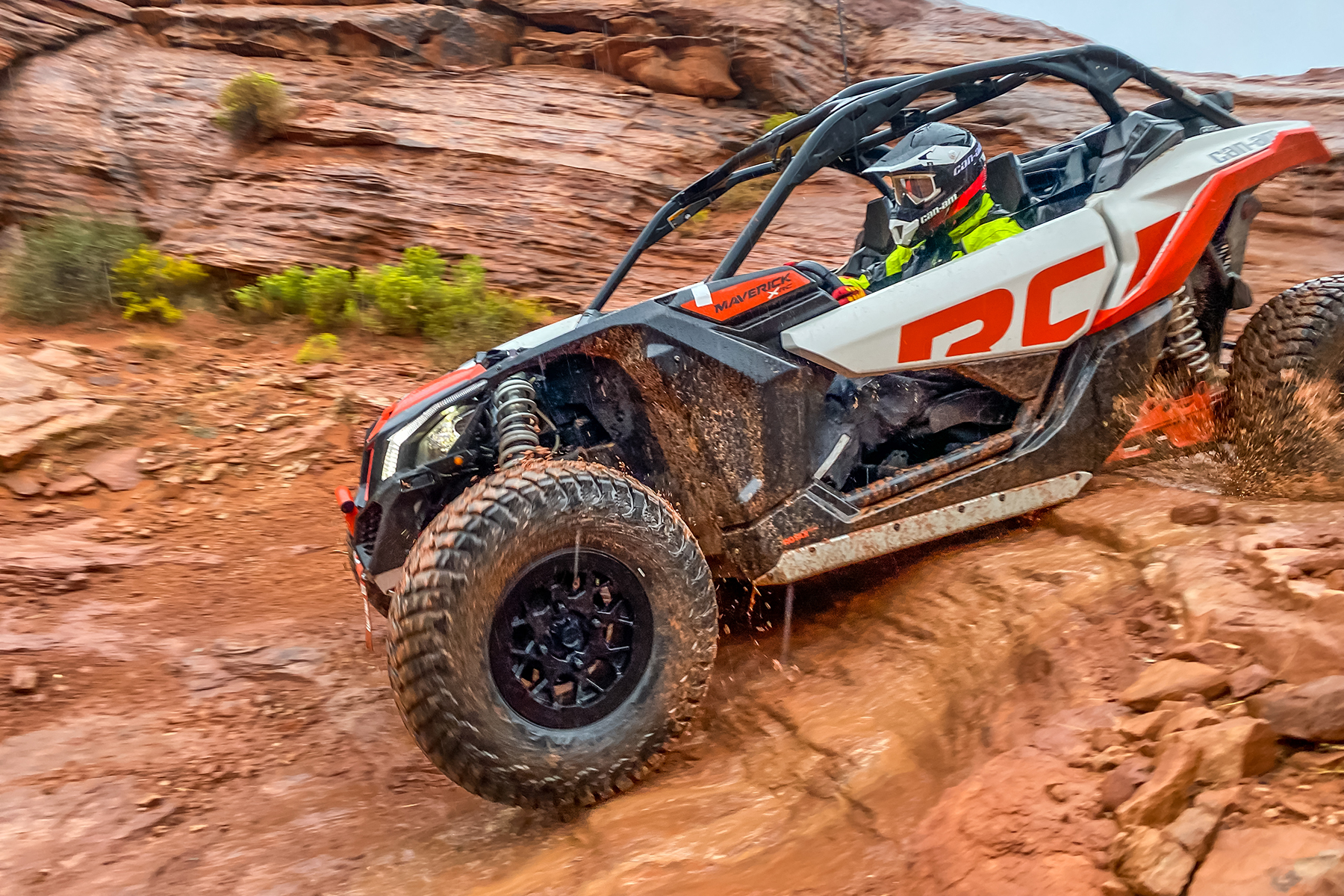 Can-Am drives down steep slippery rocks at International Off Road Day in Sand Hollow State Park at Trail Hero.