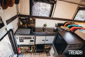 The kitchen area is complete with a sink