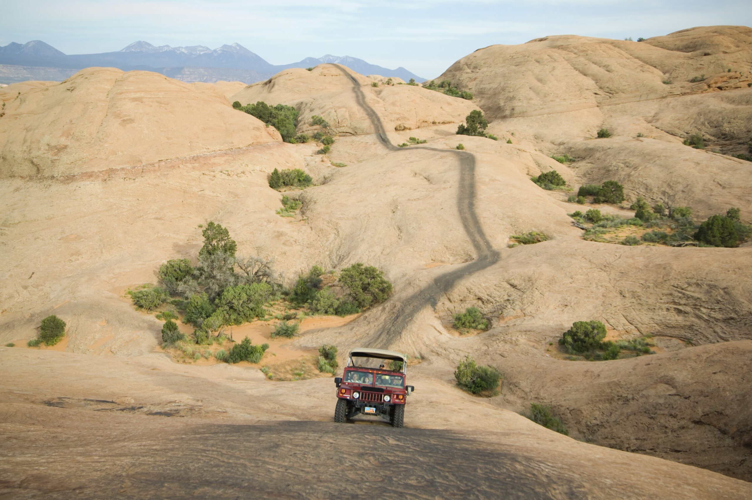 Off-road vehicle driving on rock formation