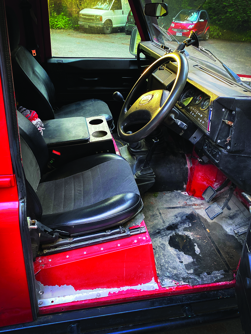 The front seats of McKay's Defender.