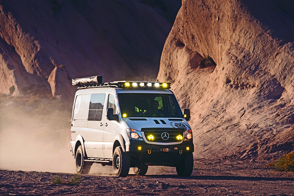 The Mercedes Benz Sprinter van gets pushed off road.