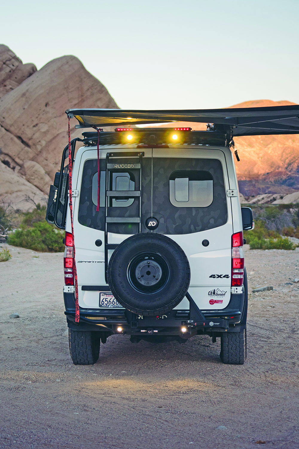 A full-sized spare sits on the 2018 4x4 diesel Mercedes Benz Sprinter