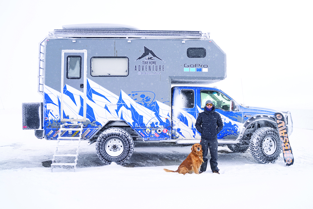 Andrew Muse and his dog outside of the MUSEROAMER at Skyline Drive.