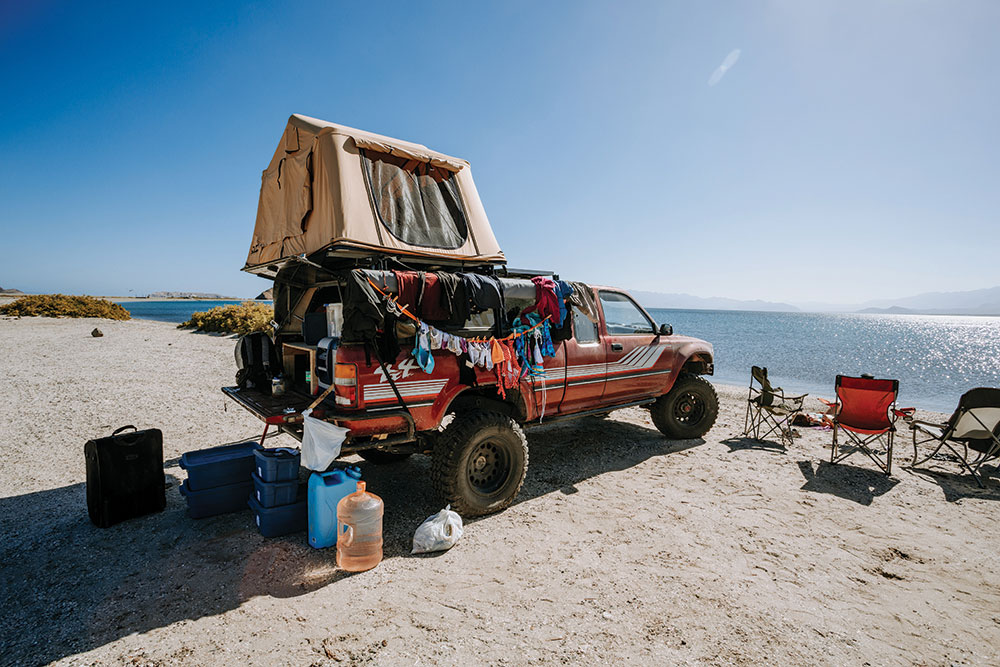 The Toyota Pickup parked on the beach.