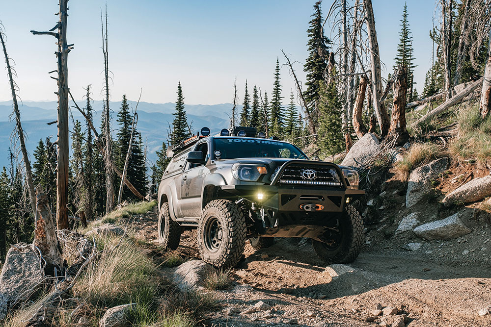 The front bumper of the Tacoma is reinforced to protect the hood.