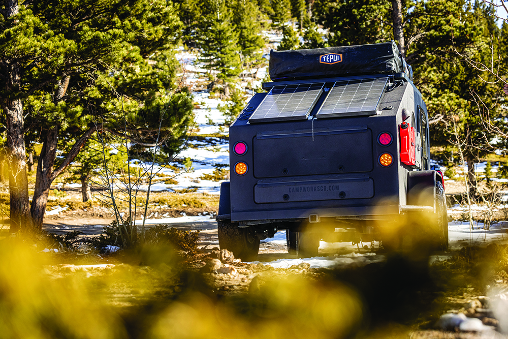 A rear shot of the Campworks NS-1 trailer highlights its solar panels.