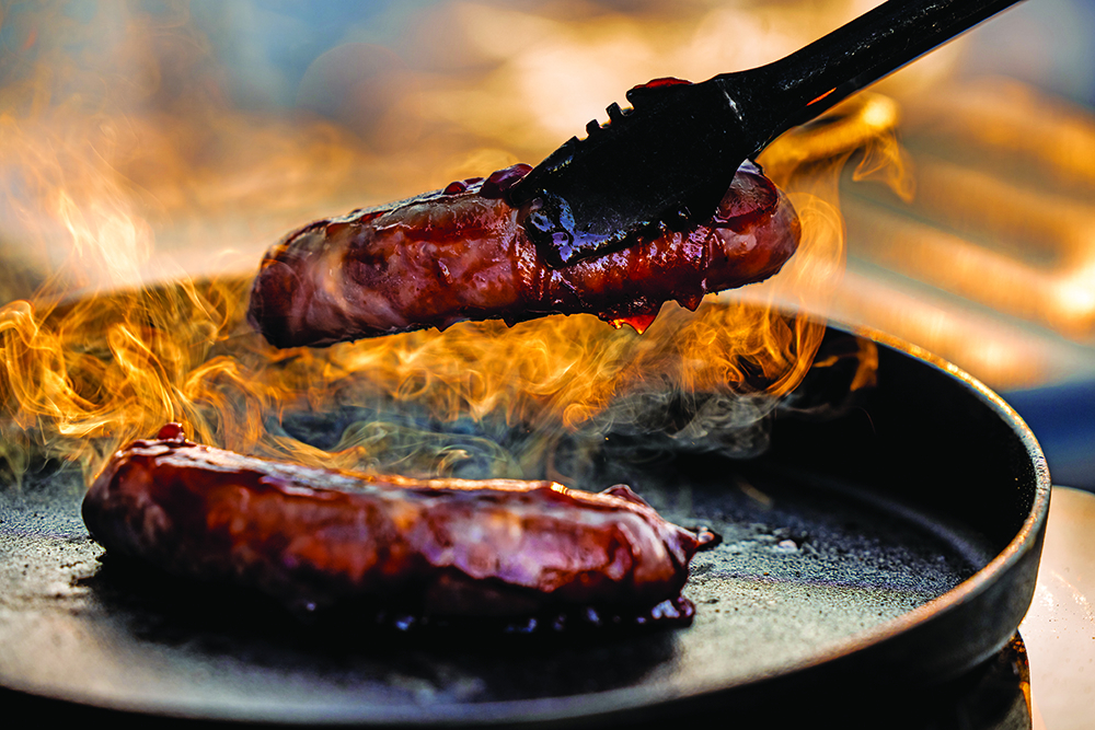 Steaks sizzle on case iron using the induction cooktop.