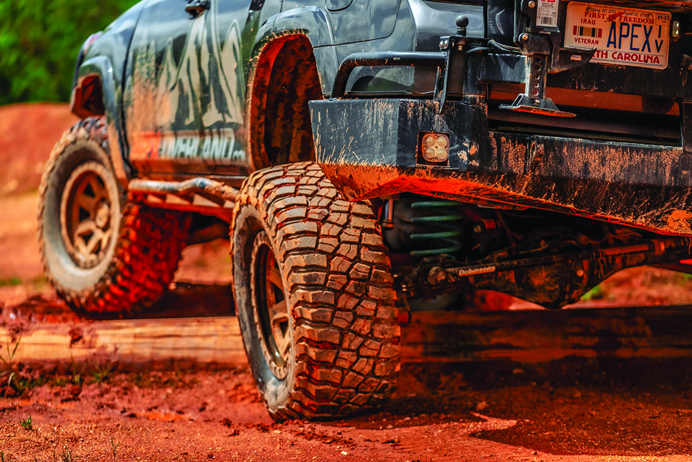 The 4Runner's dirty wheels are supported by custom springs.