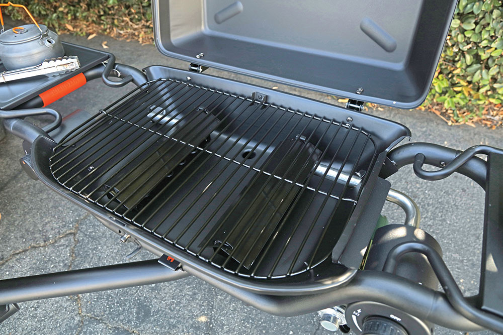 The Hitchfire Grill with the lid open to show the grate underneath