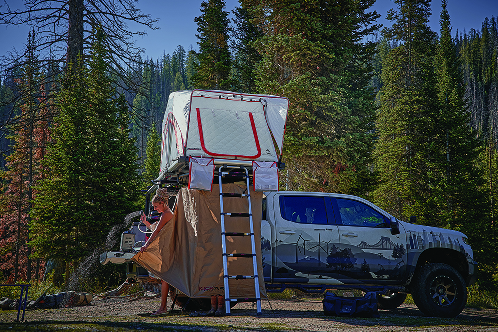 Yeti Norvell and his girlfriend Yeti shower next to the truck.