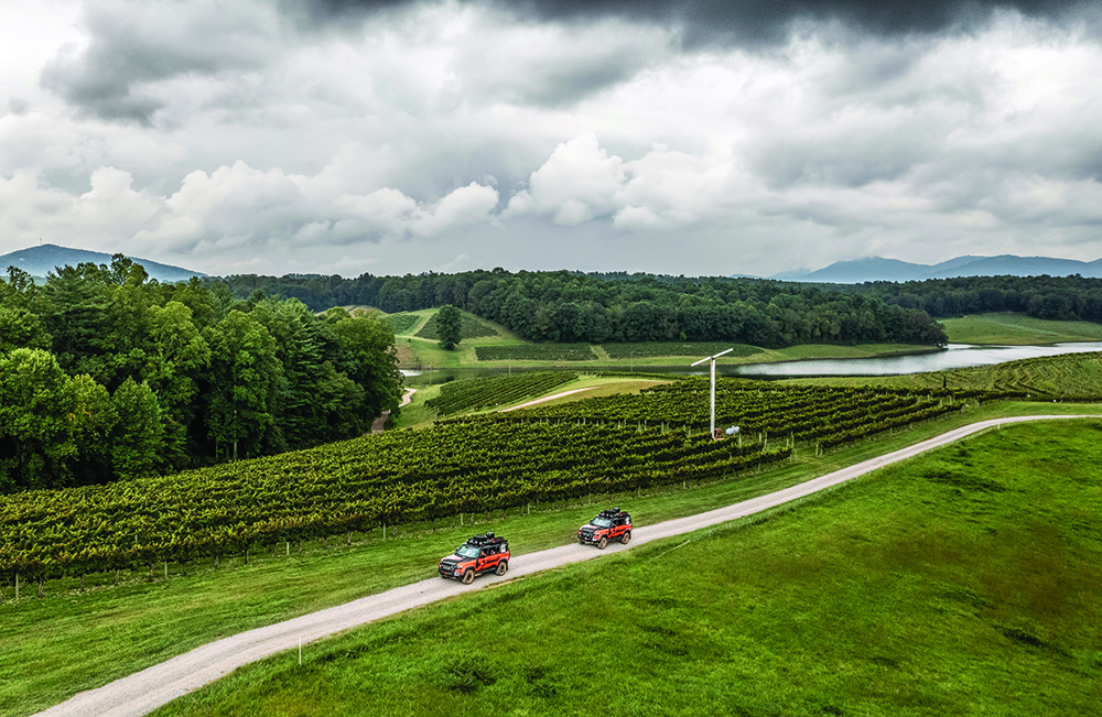 2021 Land Rover Defender 110 driving across the Biltmore Estate in the Land Rover TReK 2021 competition