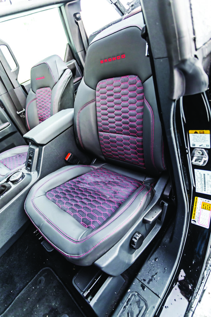 Purple stitching on the black seats make this custom Bronco's interior unique.