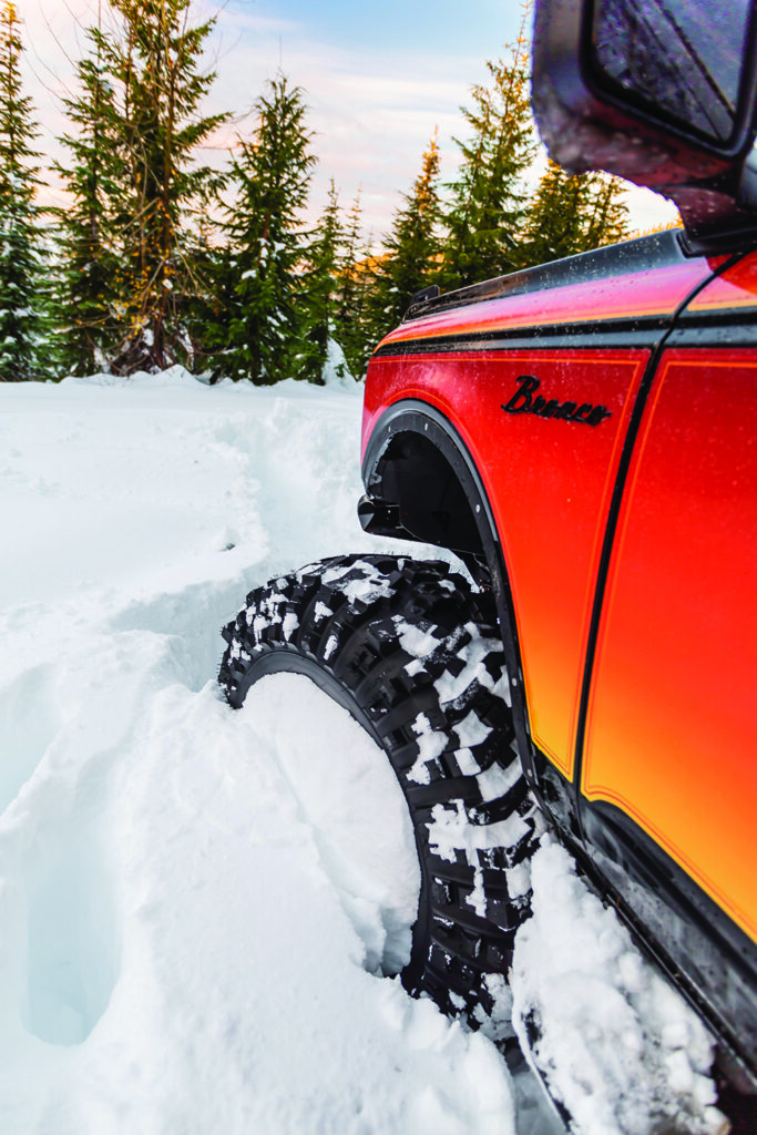 The black script Bronco emblem stands out against orange wrapping.