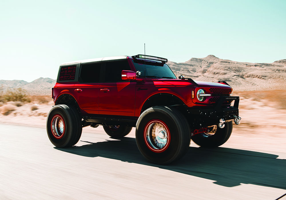 A Red Ford Bronco on the road