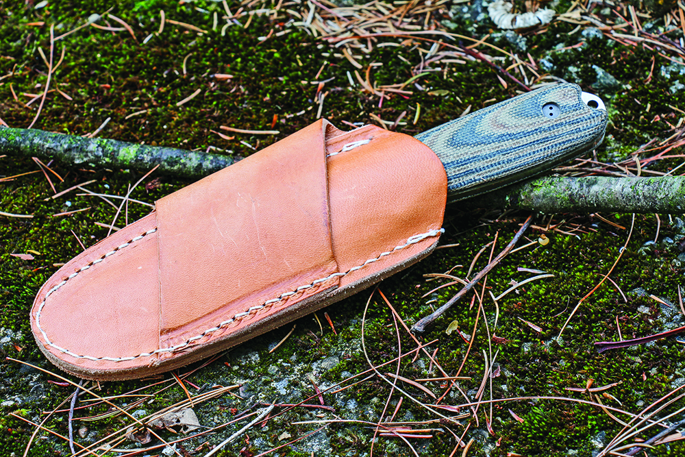 The blade in its leather sheath.