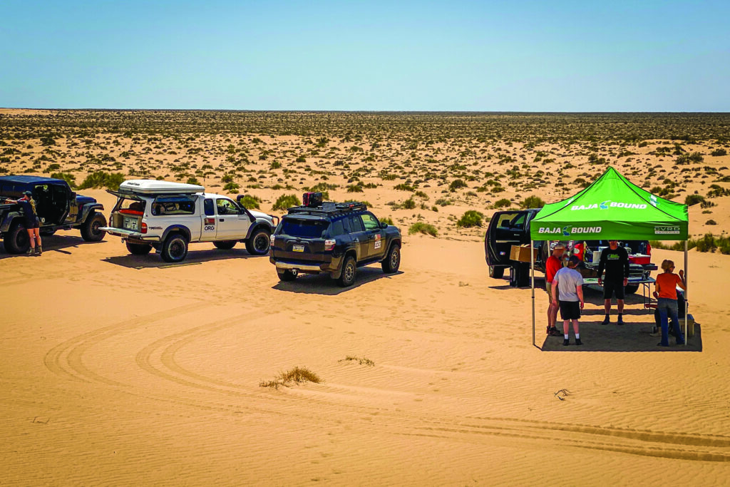 The sand dune adventurers gather at a lunch stop.