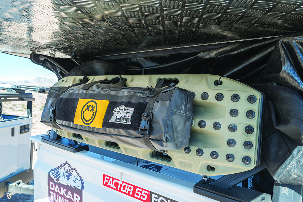 Recovery gear is mounted on the side of the bed rack.