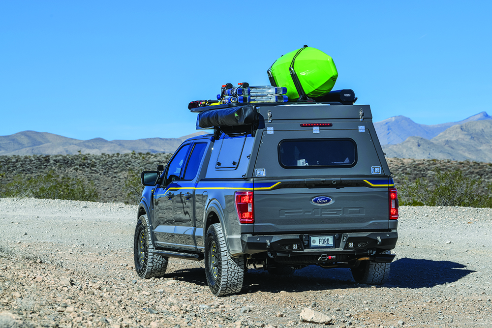 A rear shot of the F-150 rolling down a trail.