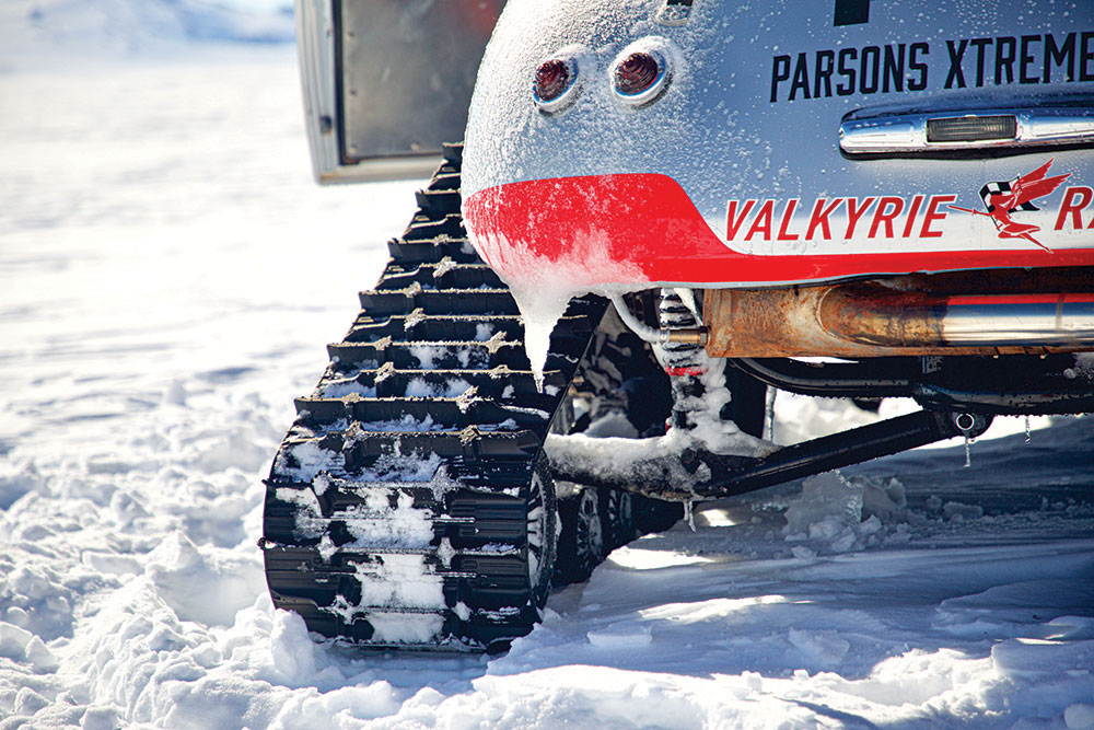 The left of the Porsche's rear bumper gives a good angle on the snowy treads.