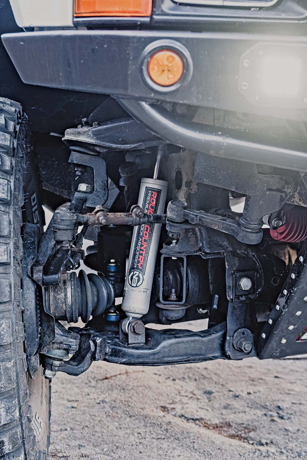 The Rough Country four-inch suspension kit shows off through the front.