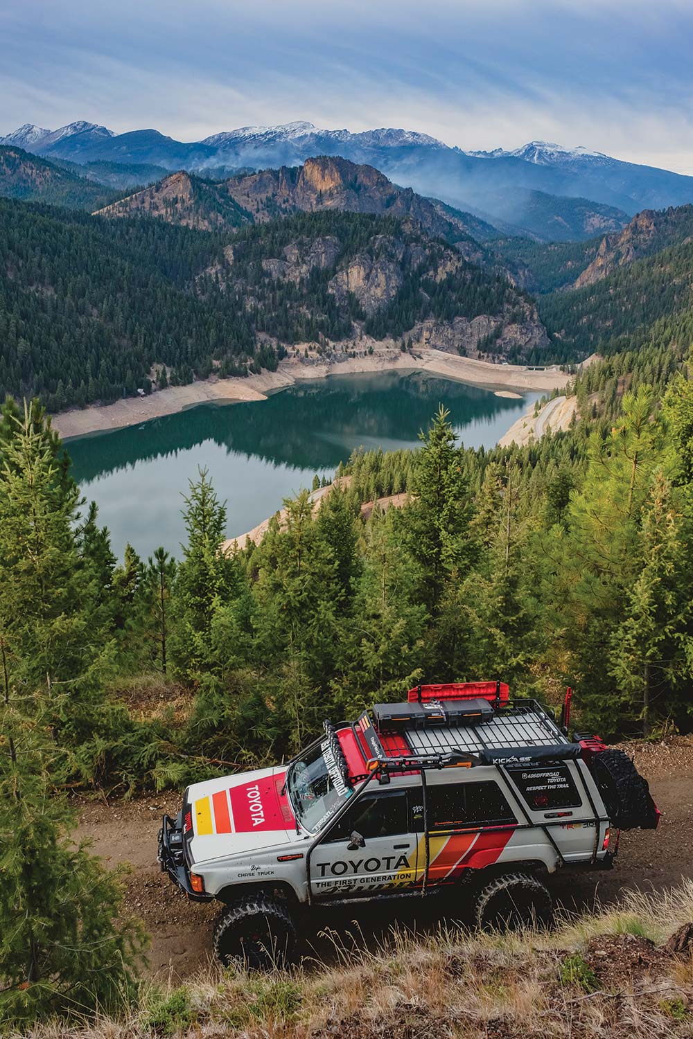 The 4Runner explores some beautiful terrain above a blue lake.