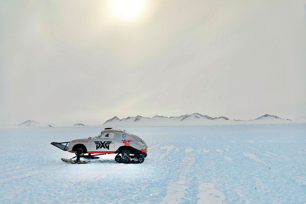 A wide shot of the Porsche parked on icy flatlands.